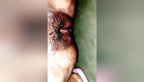 Horny amateur female with a shaved pussy and hairy bush