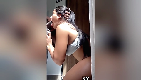 Pretty petite brunette giving a blowjob to a stranger