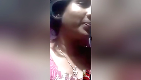 Indian brunette girl in a red dress and a black leather satch