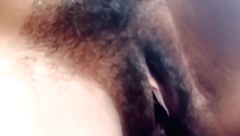 Indian woman is showing her hairy pussy in solo video