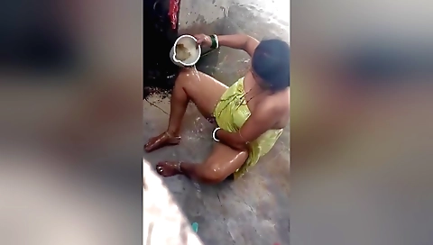Indian babe in a private bathroom has fun with her pussy
