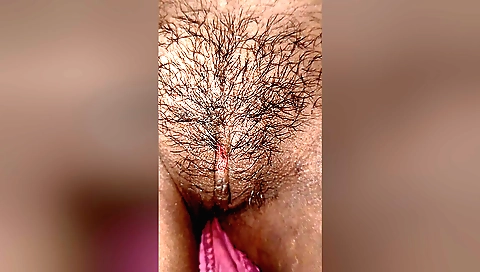 Hairy indian girl is playing with her pussy in bed