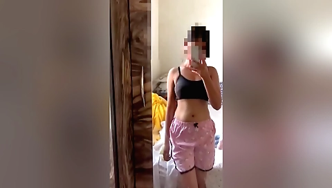 Sexy brunette college student is naked and naked in her bedroom