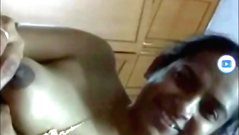 Busty brunette in a white blouse enjoys solo masturbation