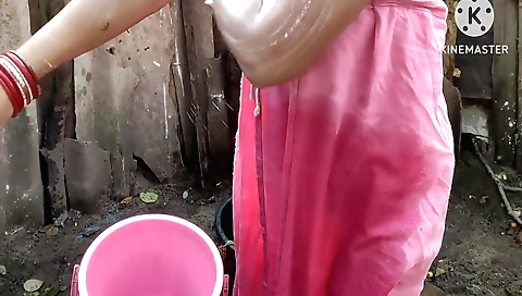 Homewife takes shower with raindrops on face and hand