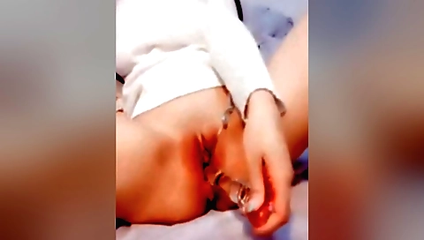 Cute amateur brunette is masturbating on her solo video