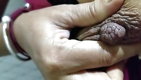 Sexy indian chick 18+ is fingering her pussy in a standing position