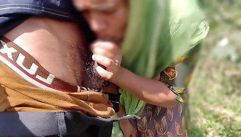 Indian brunette in a jungle is having a nice handjob